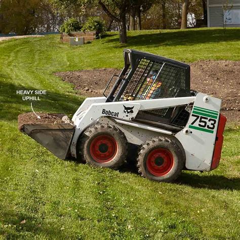 how to go up a hill in a skid steer|regrading hills to reduce slopes.